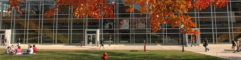 Students walking in front of the Center of Performing Arts building.